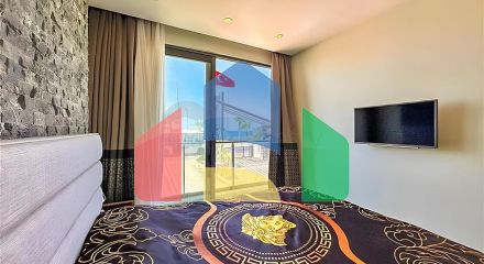 Квартира планировкой 2+1 на первой береговой линии в Махмутлар