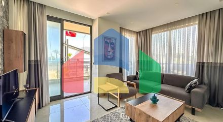 Квартира планировкой 2+1 на первой береговой линии в Махмутлар