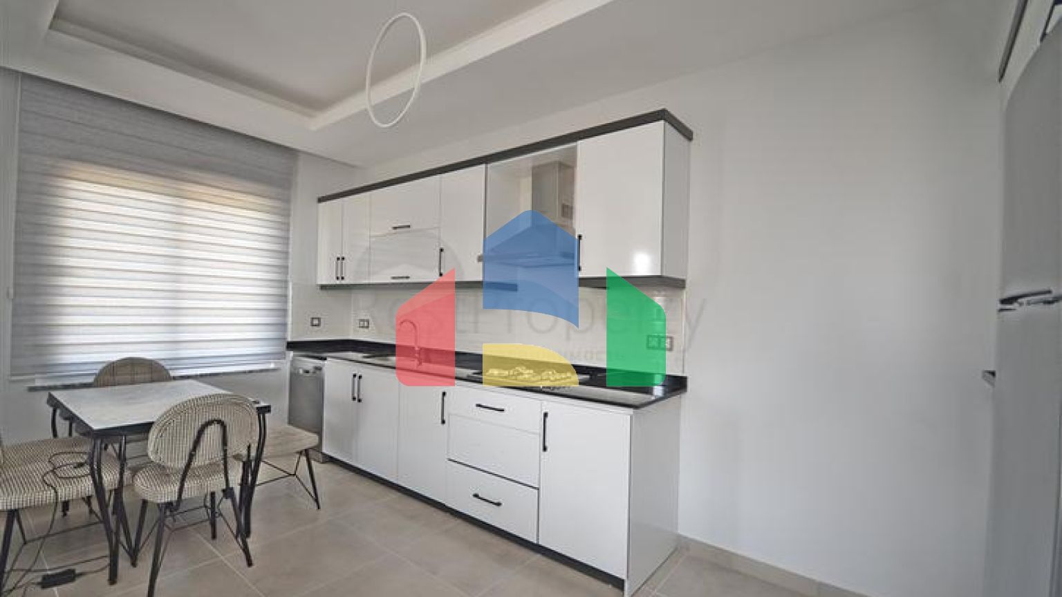 Трехкомнатная квартира в районе Махмутлар