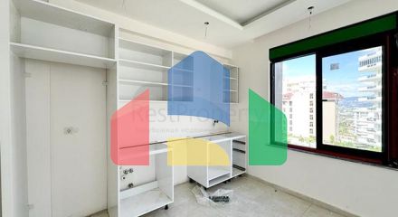 Квартира плануванням 1 + 1 в споруджуваному будинку в районі Махмутлар