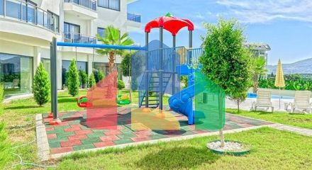 Трехкомнатная квартира в районе Махмутлар с видом на горы Трехкомнатная квартира в районе Махмутлар с видом на горы