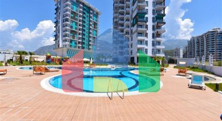 Квартира 1+1 с видом на горы и море в районе Махмутлар