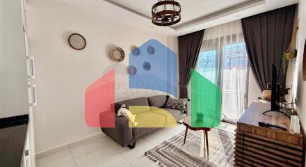 Затишна квартира 1 + 1 в сучасному будинку в Махмутларі